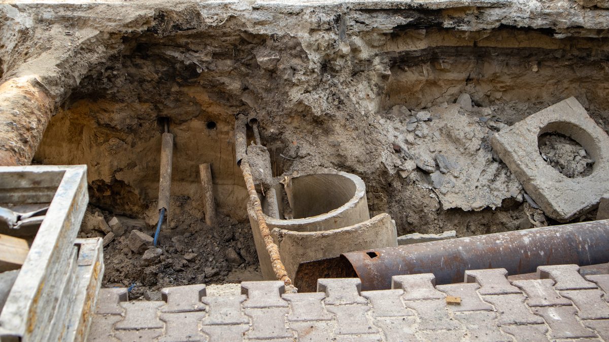 Excavated trench opened in a road for storm drain work